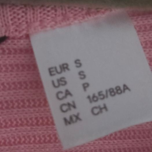 Pink long sleeve top cut back, size 10