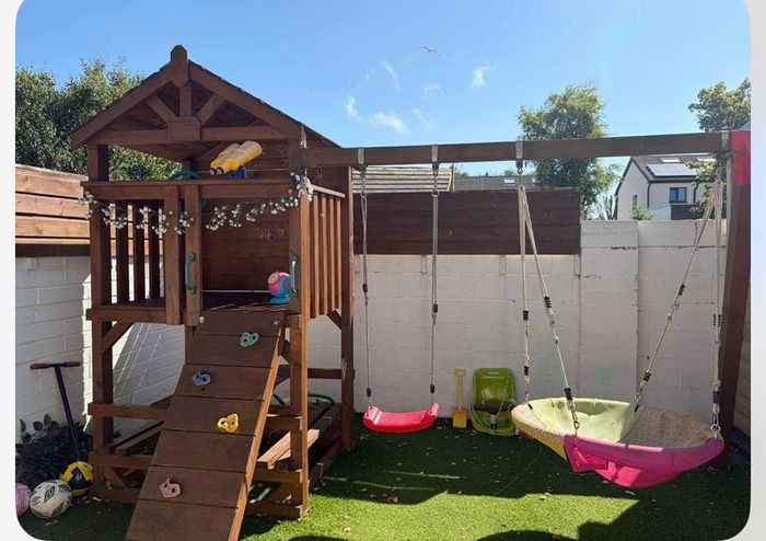 Gorgeous swing set with tree house