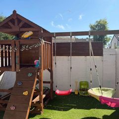 Gorgeous swing set with tree house