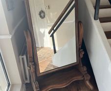 Victorian mahogany cheval mirror. c. 1880. Brass castors.