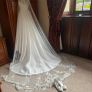 Beautiful cathedral length veil with flower and subtle sparkle detail Image 3
