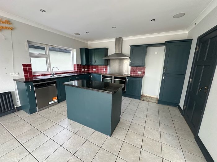 Solid oak shaker kitchen painted in railings