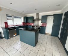 Solid oak shaker kitchen painted in railings