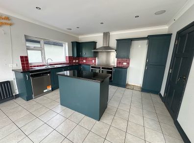 Solid oak shaker kitchen painted in railings