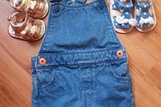 baby dungarees and sandals