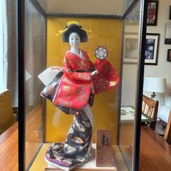 japanese figure in glass case