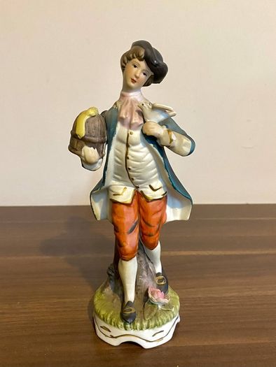 Porcelain Figurine Bisque Colonial Boy in Waistcoat Holding Bird Cage Arnart