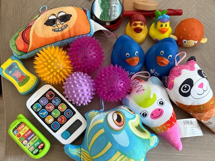 baby toys selection, balls, teddies, toy phones, ducks