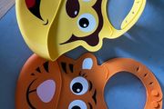 Two animal themed plastic feeding bibs