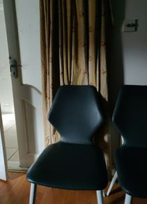 4 grey leather chairs