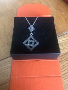 silver pendent and chain