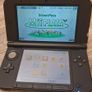 Red Nintendo 3DS xl and Aqua Blue Nintendo 3DS Image 3
