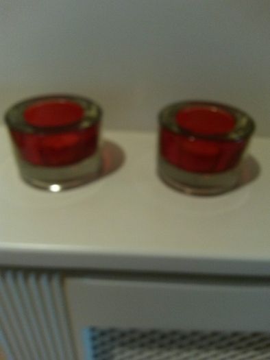 Two red tealight holders