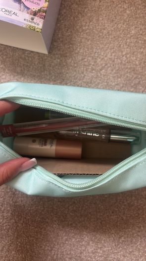 Brand new makeup bag and four brand new products