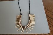 Crocodile Dundee necklace.