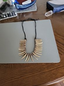 Crocodile Dundee necklace.