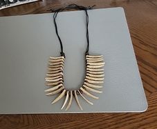 Crocodile Dundee necklace.