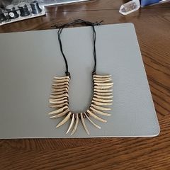 Crocodile Dundee necklace.