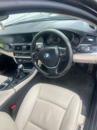 BMW 5 series, black with cream leather interior