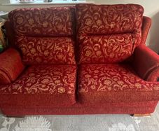 Red and gold 2 seater reversible print sofa