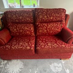 Red and gold 2 seater reversible print sofa