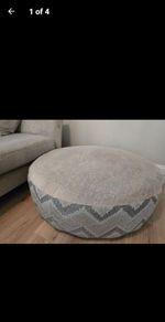 DFS Lawrie large round patterned and plain footstool,