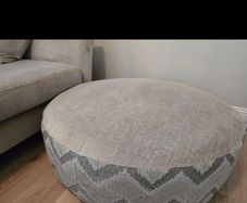 DFS Lawrie large round patterned and plain footstool,