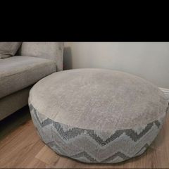 DFS Lawrie large round patterned and plain footstool,