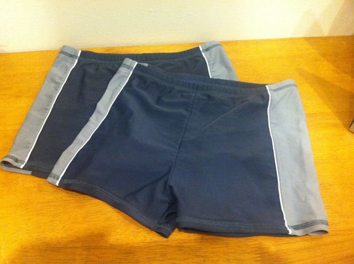 Two pairs of Boys swimming trunks, aged 9-10 years.