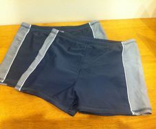 Two pairs of Boys swimming trunks, aged 9-10 years.