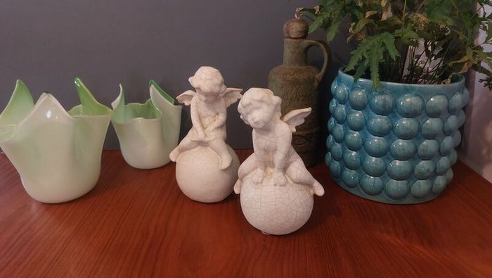 Lovely Vintage Pair of Ceramic Baby Winged Angels Sitting on Globes with a Very Tactile Cream Coloured Crackle Glaze