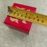A small wooden trinket / gift box painted red with hand painted flower. Image 4