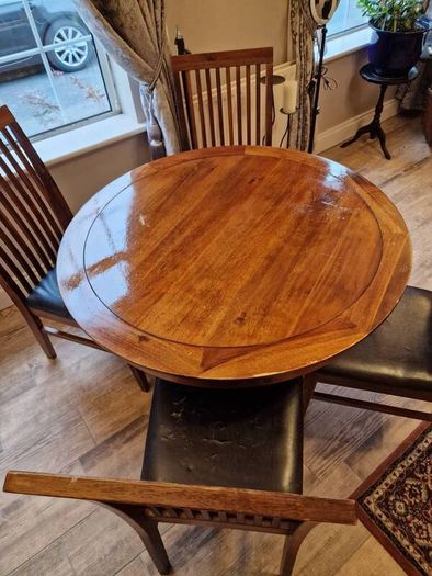 Round wooden table and four chairs