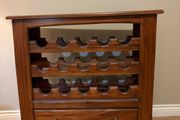 Mahogany wine rack with storage drawer