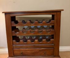 Mahogany wine rack with storage drawer