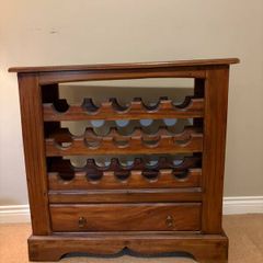 Mahogany wine rack with storage drawer