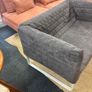 Grey quilted sofa with white metal frame Image 2