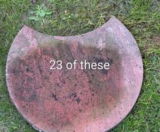 25 assorted paving patio slabs plus 2 lengths of concrete edging
