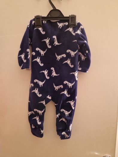 A selection of brand new baby clothes and items