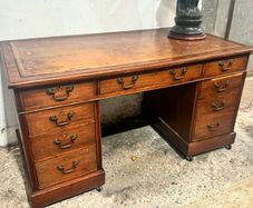 Vintage mahogany pedestal desk with leather top