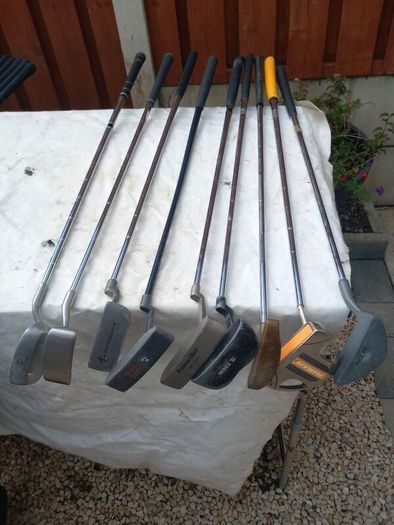 A selection of Golf clubs. Bags and golf balls.