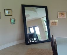 floor standing black mirror 137cm w x 242 h