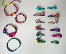 Assortment of girls hair clips and Braclets
