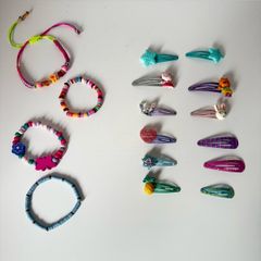 Assortment of girls hair clips and Braclets