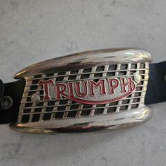 A Triumph bike metal plate.