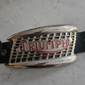 A Triumph bike metal plate.