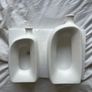 Brand new modern, hollow-center white ceramic/porcelain decorative donut-shaped vases. Image 2