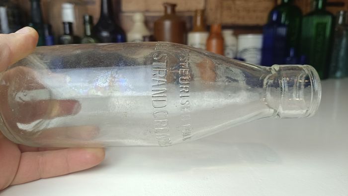 502 - Vintage Clear Glass Cork Top Collectible Decorative Lee Strand Creamery Milk Bottle