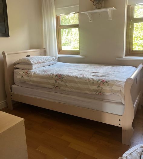 Beautiful cream single sleigh bed. Mattress included.