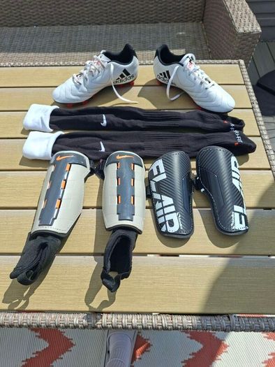 Addidas football boots, shin guards and socks.